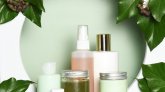 Arrangement of skin care products with ivy leaves