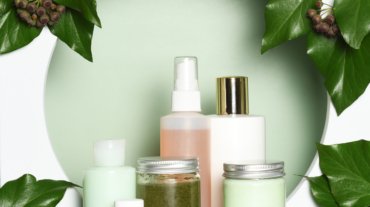 Arrangement of skin care products with ivy leaves