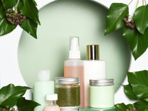 Arrangement of skin care products with ivy leaves